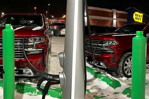 Cheeky Chevy Silverado Pretending To Be Charging At EV Station With Cable Doesn’t Fool Anyone