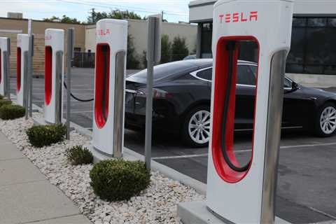 Tesla's EV charging team layoffs threaten to slow Biden's program to electrify highways